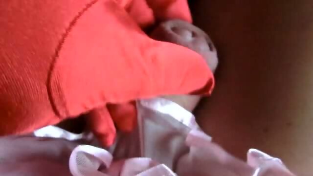 Sissy in gloves masturbates cock