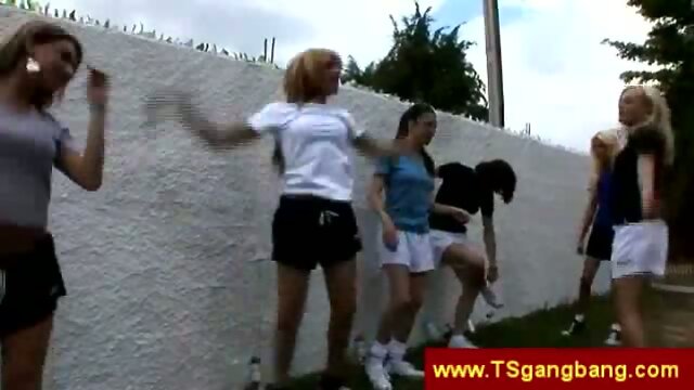 Sporty shemales stretch outdoors