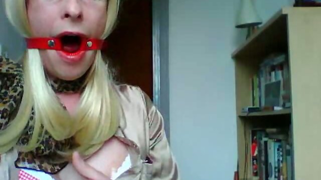 Sissy in satin and gag