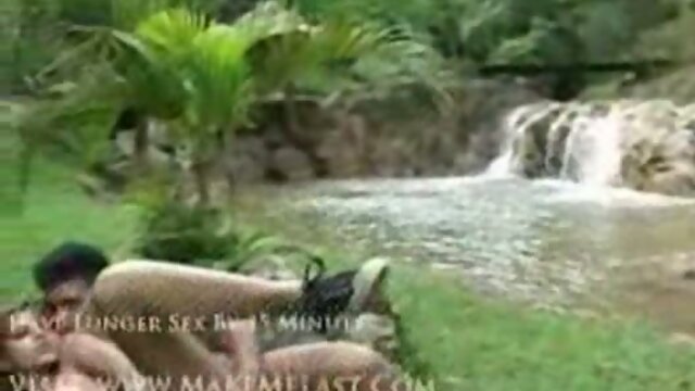 Shemale sex by a waterfall