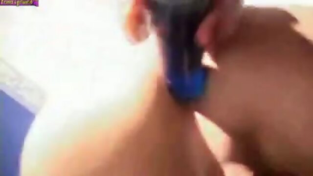 Shemale redhead in latex boots