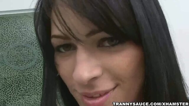 Bruentte shemale babe tugging her rock hard cock