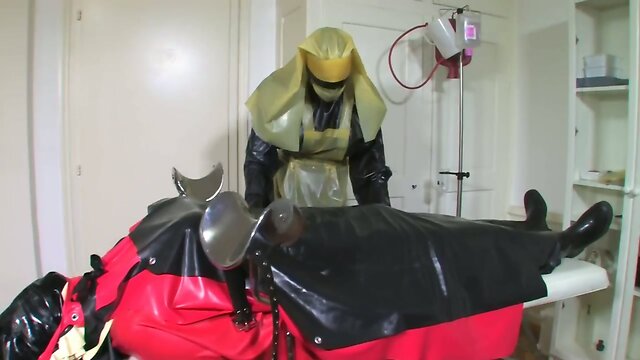 Bizarre rubber apron bondage 4 of 5