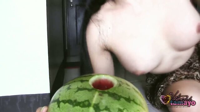 TS Vitress Tamayo puts her cock in a melon.