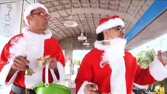 Tranny Kylie gets her Christmas gift from two big cocks