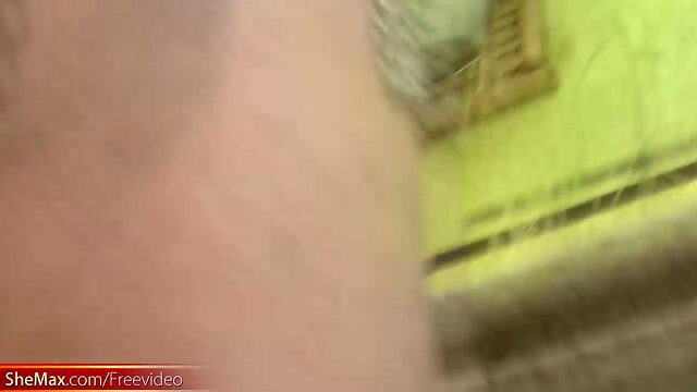 Redhead T-girl in see through dress enjoys her banana rama