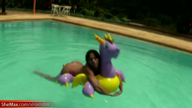 Tatooed ebony tgirl plays with good sized shemeat by pool