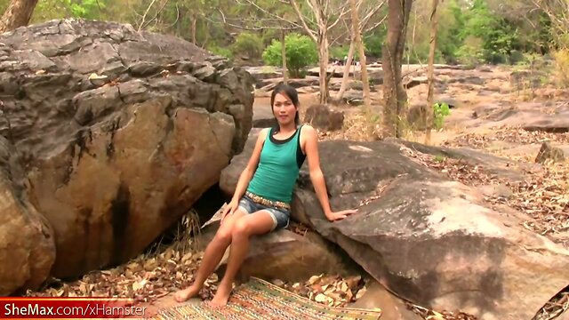 Teen ladyboy with small tits strips naked outdoors and jerks