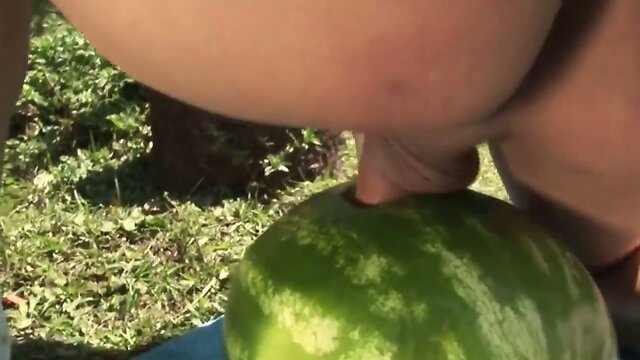 Shemale fucks a watermelon