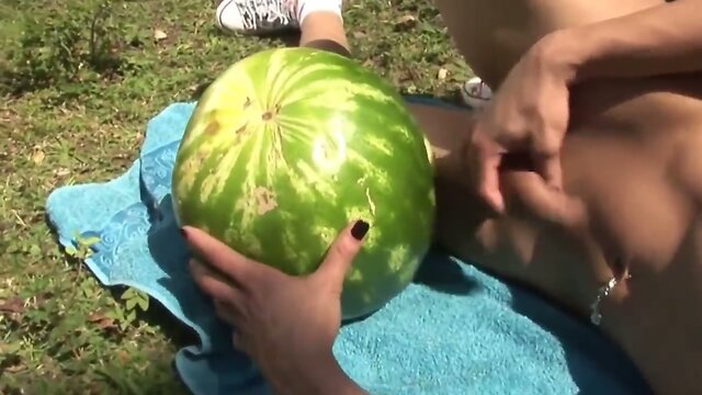 Shemale fucks a watermelon