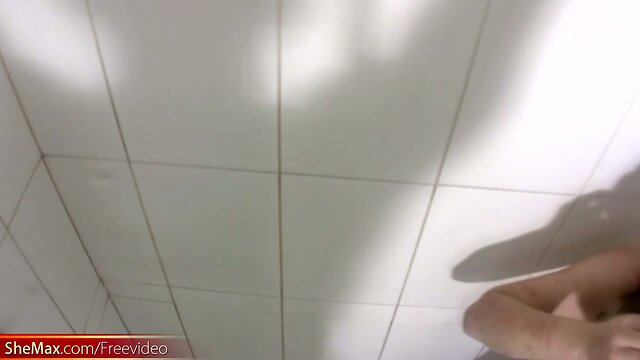 Chubby teen shemale is stroking decent sized dick in shower