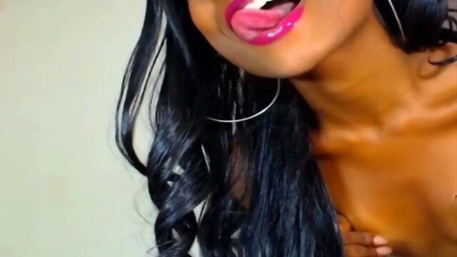 Dark-skinned colombian shemale is wanking her big cock