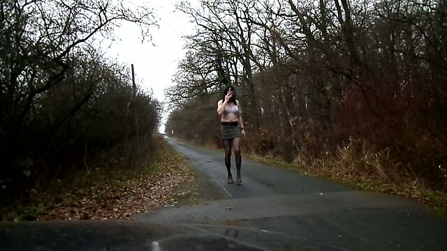 sandralein33 smoking in Bra und short skirt on street