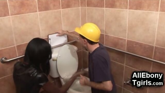 Ebony Trans Domme Punishes The Old Plumber!