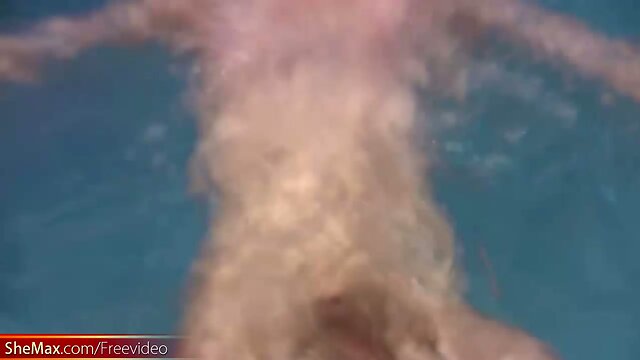 Big ass tranny plays with her massive penis in pool and cums