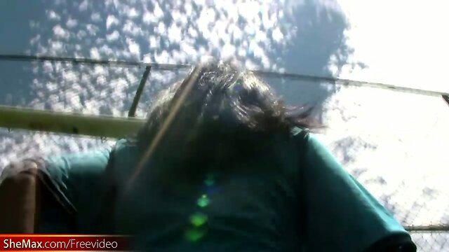 Busty Latina TS exposes big breasts and butt on soccer field