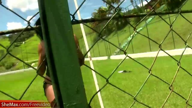 Busty Latina TS exposes big breasts and butt on soccer field