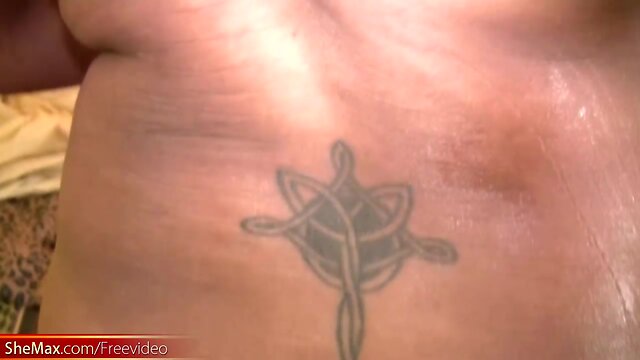 Ebony transsexual with massive boobs wanks off on the bed