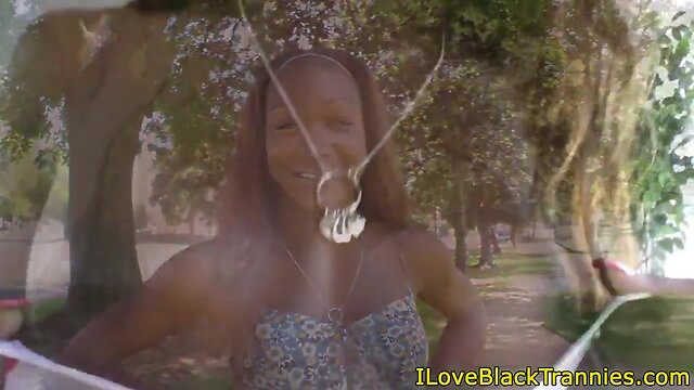 Busty black shemale tugging hard cock