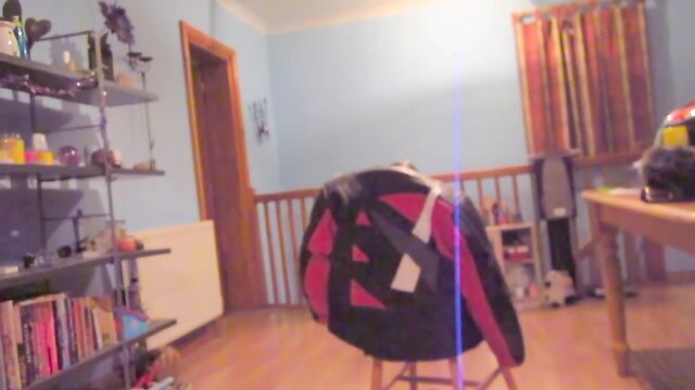 Wearing a white mini skirt suit, stockings & high heels