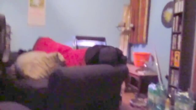 Wearing a white mini skirt suit, stockings & high heels