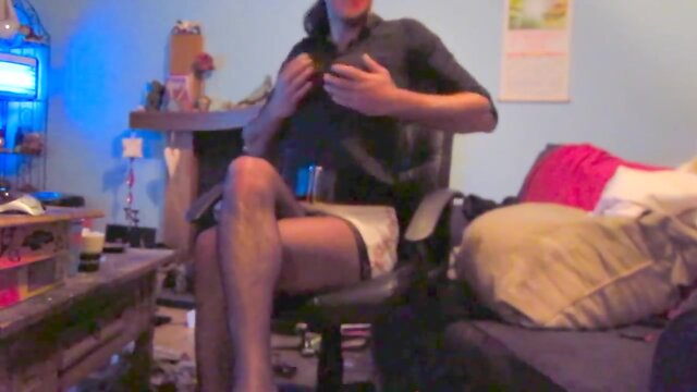 Wearing a white mini skirt suit, stockings & high heels