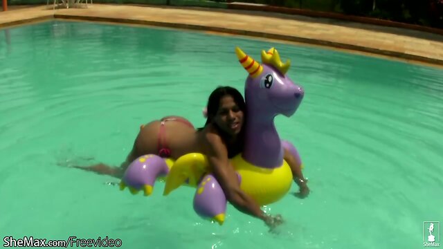 Cheerful teen shemale shows off sexy ass in thongs poolside