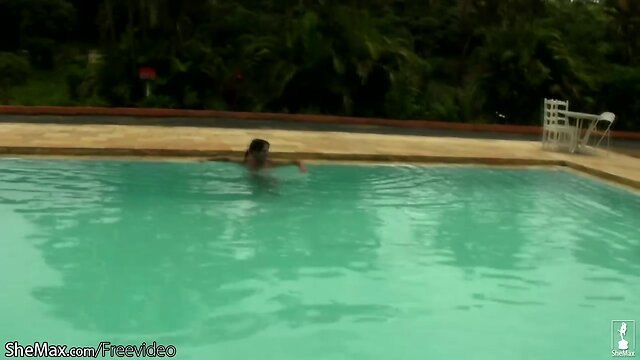 Cheerful teen shemale shows off sexy ass in thongs poolside