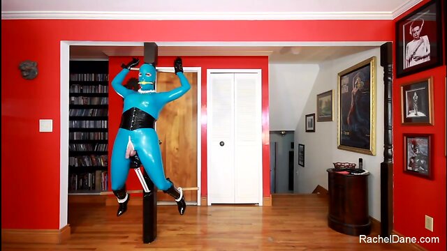 Living Latex Statue in tormented in Bondage