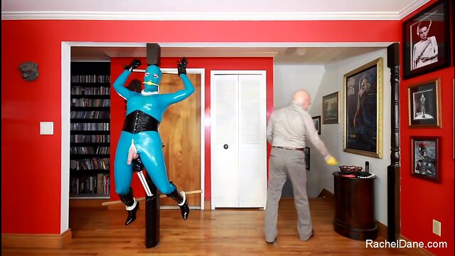 Living Latex Statue in tormented in Bondage