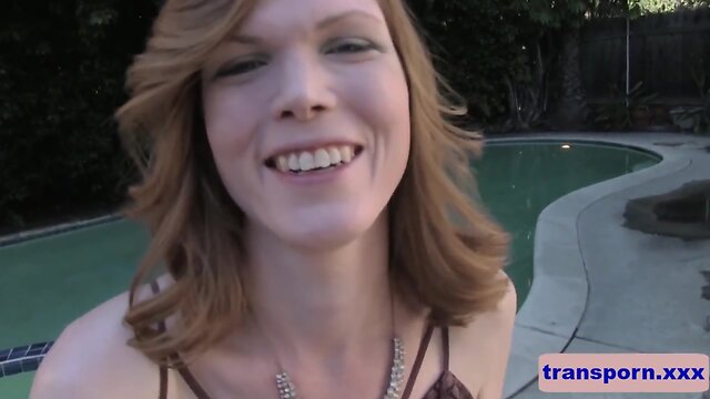 Pretty blond transsexual jerking her penis outdoors