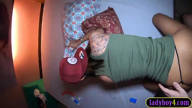 Oriental transsexual teenager sucks pecker before anal doggy style