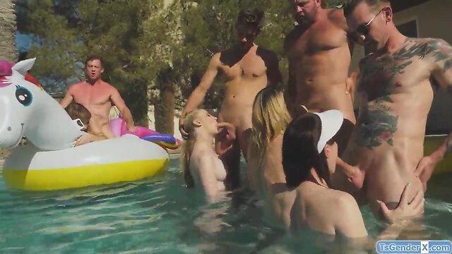 Ladyboys and guys have a pool party debauch