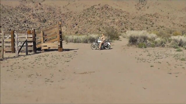 Leather biker ts in nevada desert with buttplug