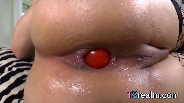 Asiatic tranny eva lin stuffs things in her ass