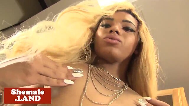 Glam black trans posing her tight body