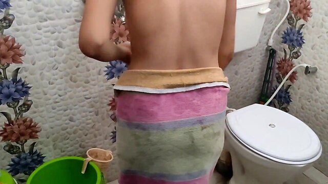 My step sister was taking a bath. i saw my step sister taking a bath and made a