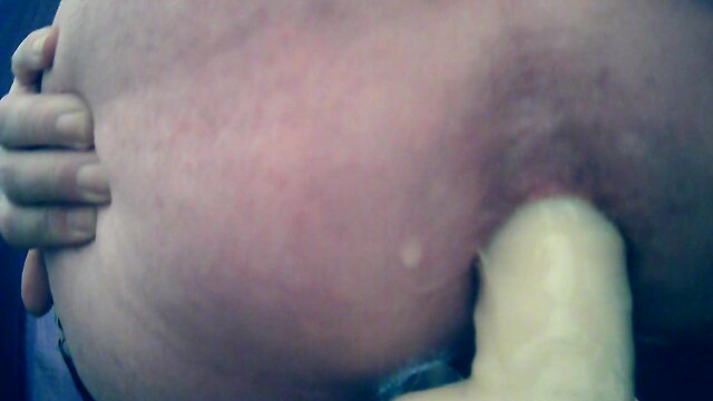 Sitting on a huge sextoy, stretching open my hole