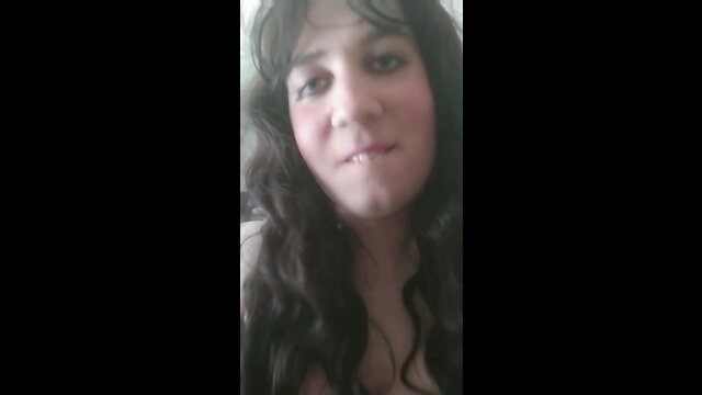 Dark haired CD annarios rubs her large dick and eats cum