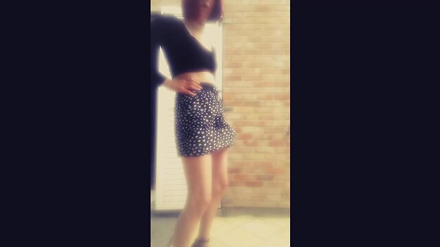 Janelle shakes her massive penis under skirt