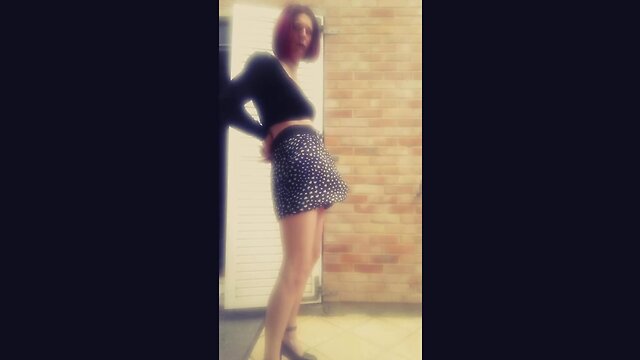 Janelle shakes her massive penis under skirt