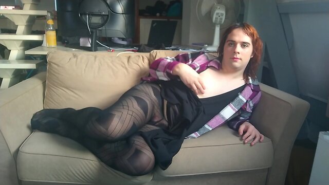 Eroused femboy fucking himself on the sofa