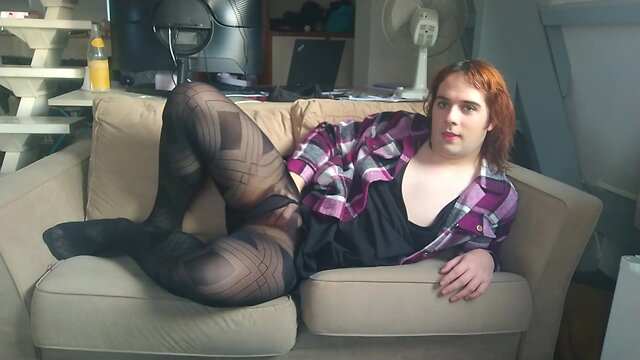 Eroused femboy fucking himself on the sofa