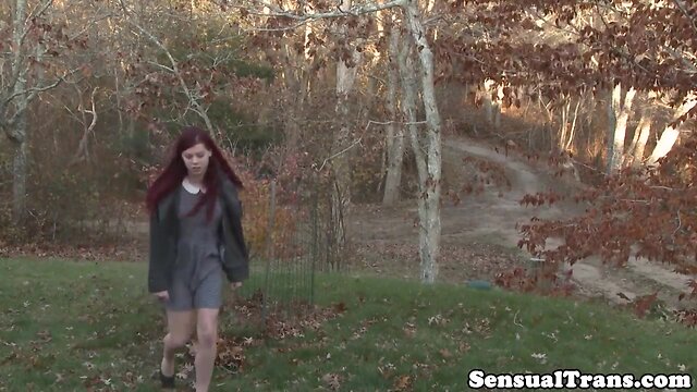 Redhead transwoman receives anal stimulation while masturbating.