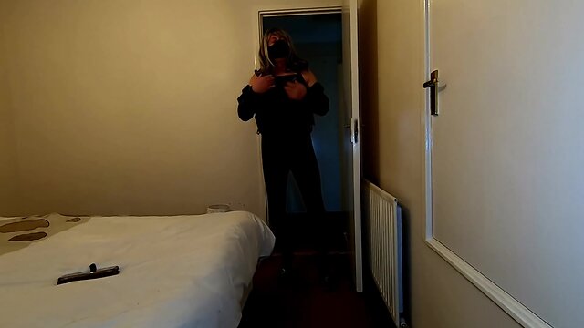 Kelly taking pleasure in bedroom play in ebony pvc leggings and cumming