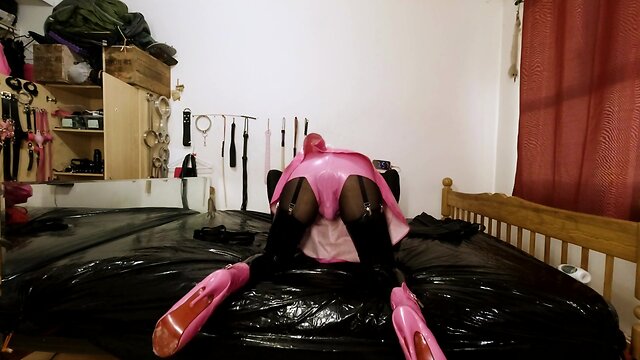 Maid hogtied and gagged in armbinder and steel chastity belt