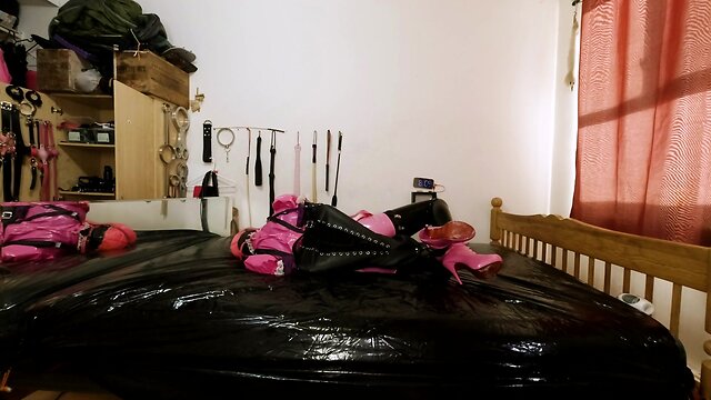 Maid hogtied and gagged in armbinder and steel chastity belt