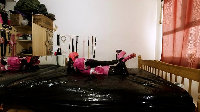 Maid hogtied and gagged in armbinder and steel chastity belt