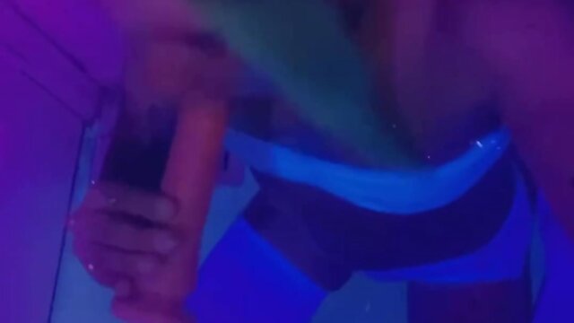 Dancing in rave lingerie at a blacklight party