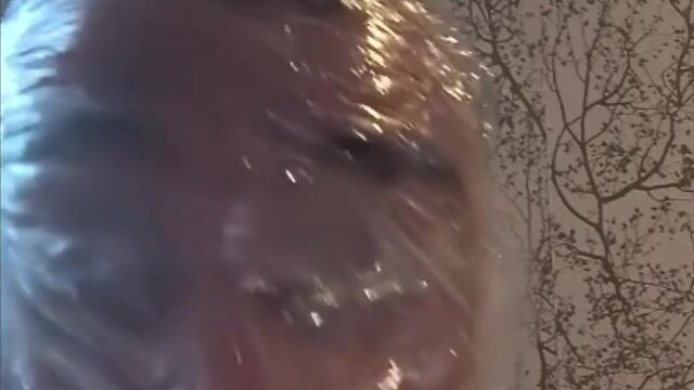 Breath play in latex catsuit with cling film